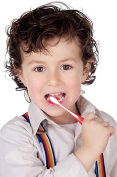 adorable boy child cleaning the teeth a over white background