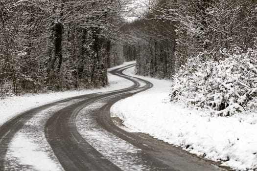 A snowy road in winter
