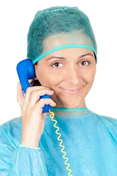 Young lady doctor speaking on the telephone over a white background