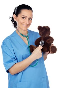Adorable doctor with a teddy bear in her arms a over white background
