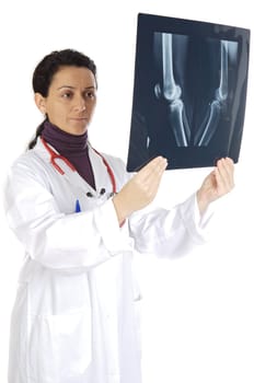doctor examining a radio graphs a over white background