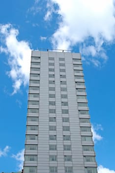 Grey Apartment Block against a blue sky