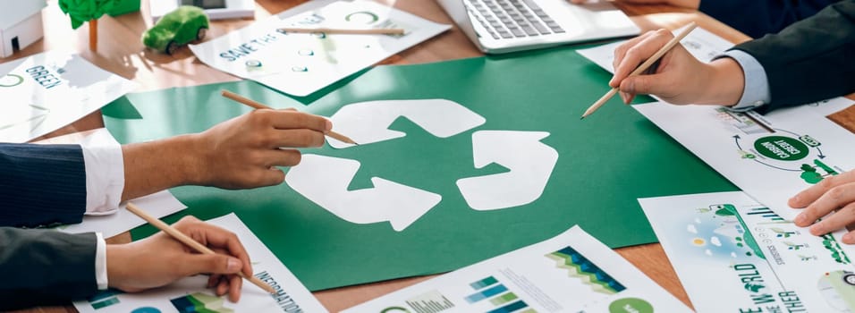 Group of business people planning and discussing on recycle reduce reuse policy symbol in office meeting room. Green business company with eco-friendly waste management regulation concept.Trailblazing