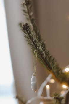 Christmas and New years eve Background. Close up of balls on christmas tree. Bokeh garlands in the background. New Year concept. Decorated Christmas tree on blurred, sparkling and fairy background