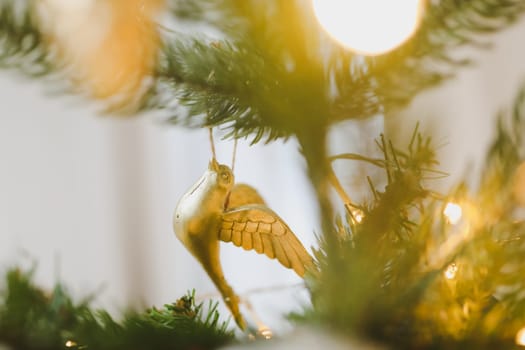 Christmas and New years eve Background. Close up of balls on christmas tree. Bokeh garlands in the background. New Year concept. Decorated Christmas tree on blurred, sparkling and fairy background