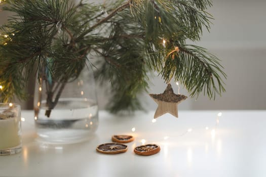 Christmas and New years eve Background. Close up of balls on christmas tree. Bokeh garlands in the background. New Year concept. Decorated Christmas tree on blurred, sparkling and fairy background