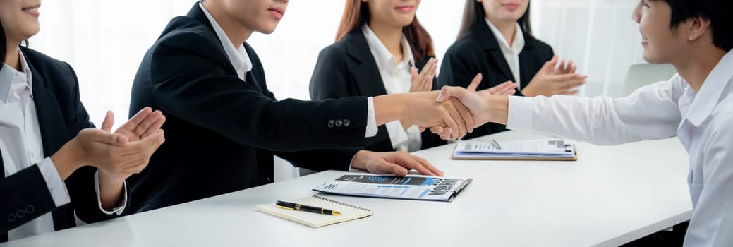 Business people group handshake at meeting table. Job interview success or making successful business oratory agreement