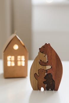 Family of wooden toy bears. Handmade wooden eco-friendly toys for kids. Cozy photo