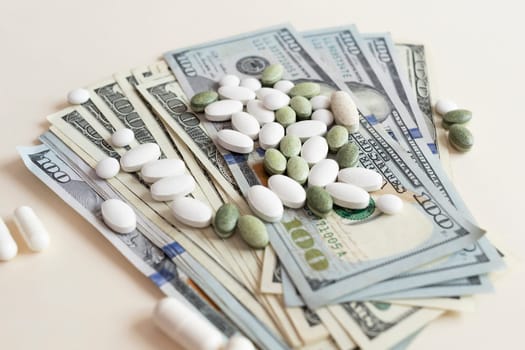 Closeup Many Dollar Money Banknotes And Different Pills Or Tablets. Expensive Medicine And Healthcare Insurances. Inflation. Pharmaceutical Industry And Big Pharma. Horizontal Plane.