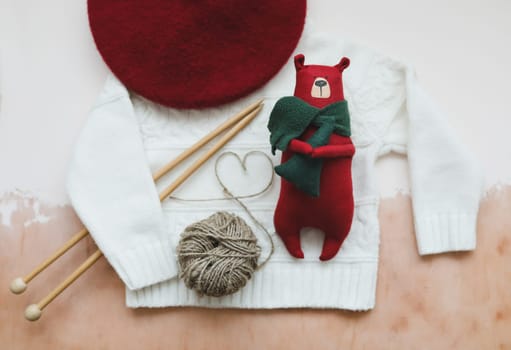 Christmas composition. Toy Teddy Bear, a gift, fir tree branches and decorations. Christmas, winter, new year concept. Flat lay, top view, copy space.