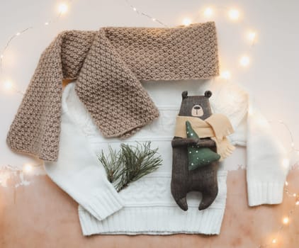 Christmas composition. Toy Teddy Bear, a gift, fir tree branches and decorations. Christmas, winter, new year concept. Flat lay, top view, copy space.