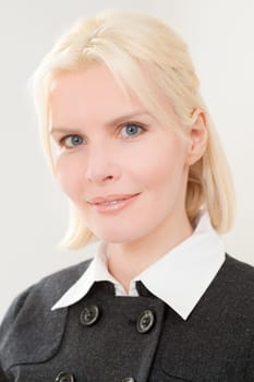 Portrait of a young and blonde businesswoman