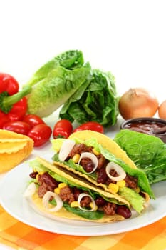 Taco shells stuffed with ground beef,kidney beans and corn