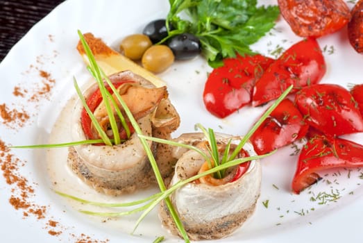 fillet of pikeperch stuffed with trout fish with baked pepper, tomato and leek
