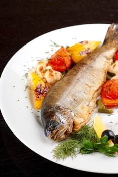 trout fish baked with pepper, string beans, tomato and cauliflower