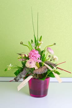 bunch of flowers composition at pot on a table