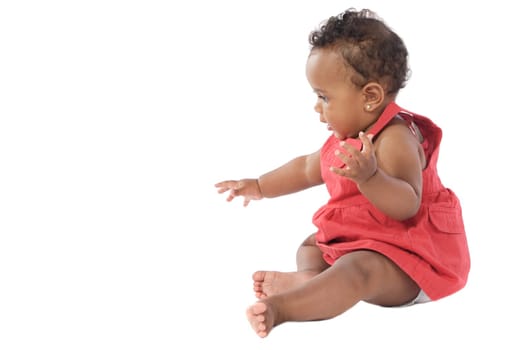 adorable baby crawling wearing a red dress