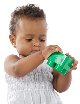 Adorable baby girl playing with building blocks