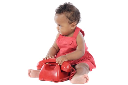 Baby with red phone a over white background