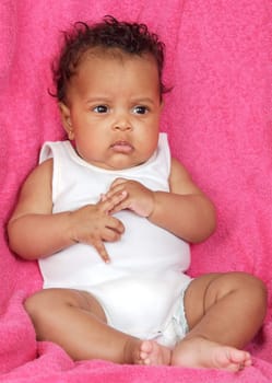 lovely and beautiful baby on a pink towel