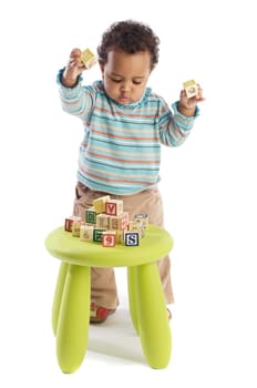 Girl playing with small pieces a over white background