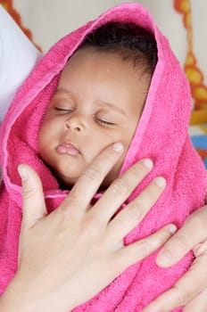 adorable sleepy girl a over pink background