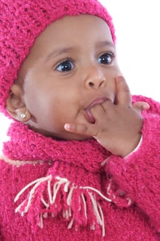 Baby with his finger in the mouth a over white background