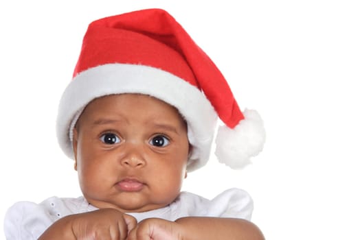 Adorable baby girl with santa hat over white background