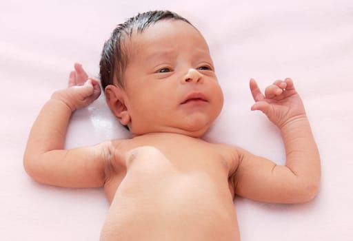 lovely and beautiful baby on a pink towel