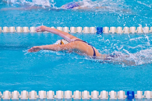woman swimming during a competition