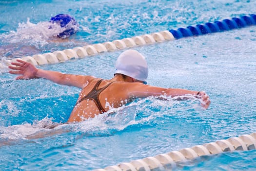 woman swimming during a competition