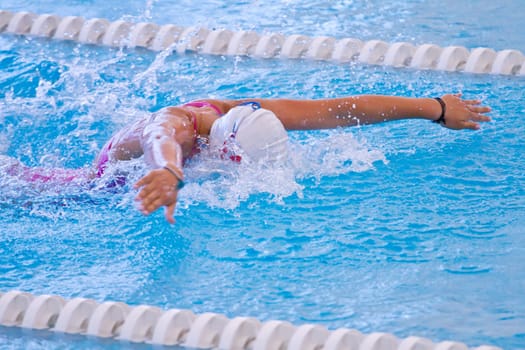 woman swimming during a competition