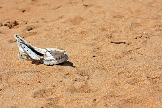 A washed up shoe on the beach in Sri Lanka