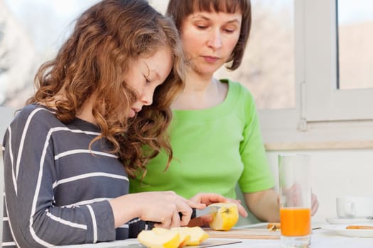 Daughter and her mom having a breakfast together