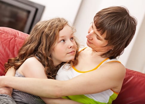 Loving mother and her daugther sitting together
