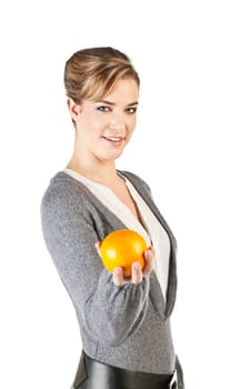 Pretty girl hold an orange in her hand  isolated on white background