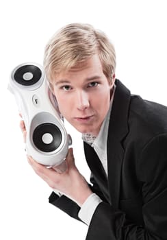 Young blond handsome man holding boombox  isolated on white