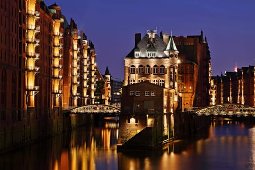 Moated castle in Hamburg's Speicherstadt in the evening