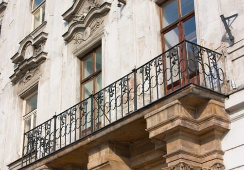 Balcony and facade of old and abandonned construction in East Europe