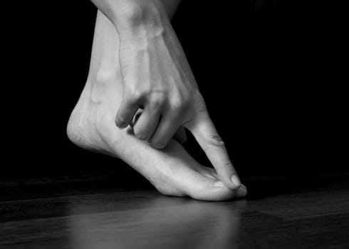 Finger touching toe, elegance, grace, delicacy