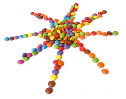 colorful candies made in sun shape isolated on white background