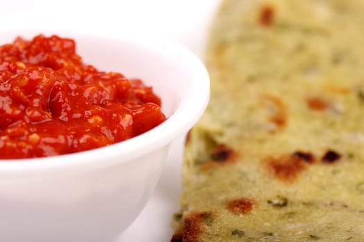 Spicy and hot chili chutney(sauce) with indian roti