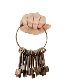 Fist with bunch of old keys on a big keyring. isolated on white