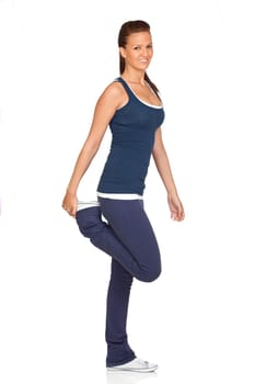 Attractive girl stretching isolated on white background