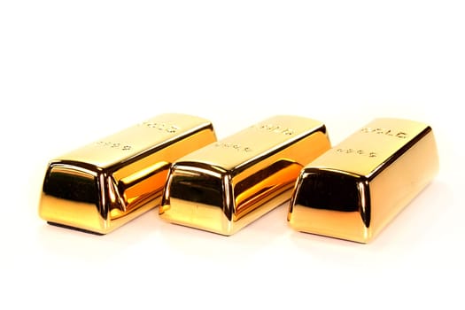 Three gold bars against white background