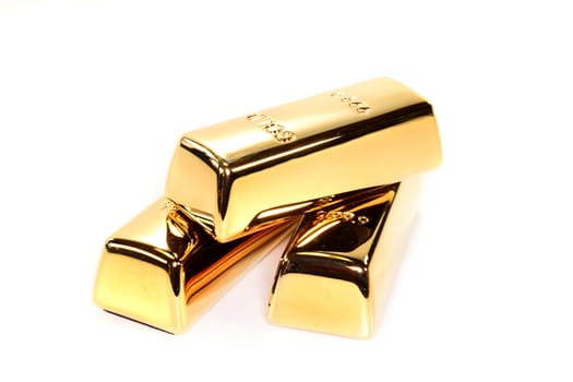 Three gold bars against white background
