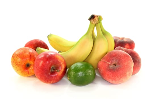 Different types of fruit against white background