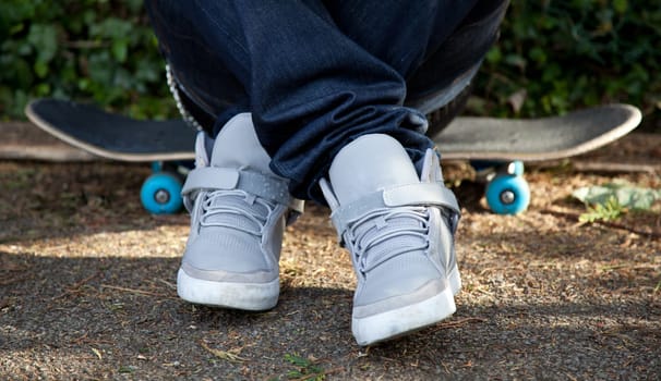 Man sitting on his skateboard
