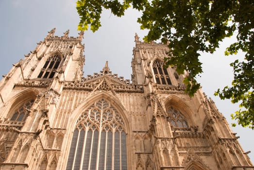 A View of the West Entrance of York Minster Yorkshire England under a blue sky