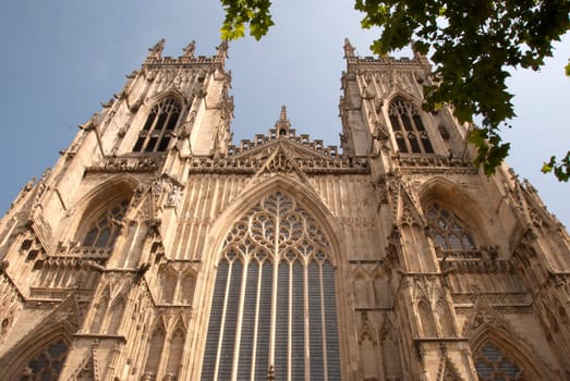 A View of the West Entrance of York Minster Yorkshire England under a blue sky